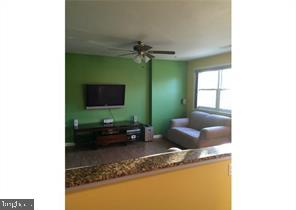 26 Eaves Mill Road Medford, NJ 08055 - Photo 6 of 9 a living room with furniture and a flat screen tv
