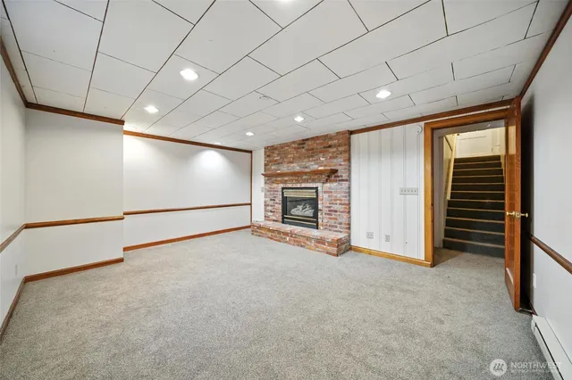 a view of an empty room with a fireplace