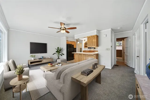 a living room with furniture and a flat screen tv