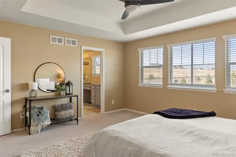 a bedroom with bed and a window