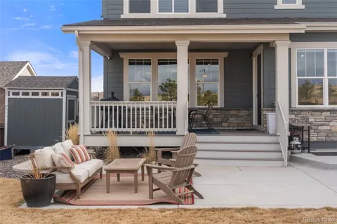 a view of a patio with a table and chairs