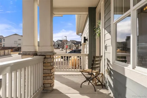 a view of a balcony with chairs