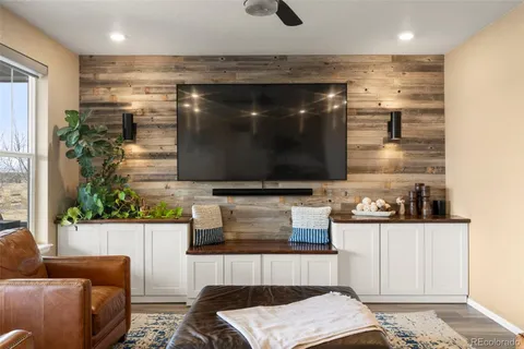 a living room with a couch and a potted plant