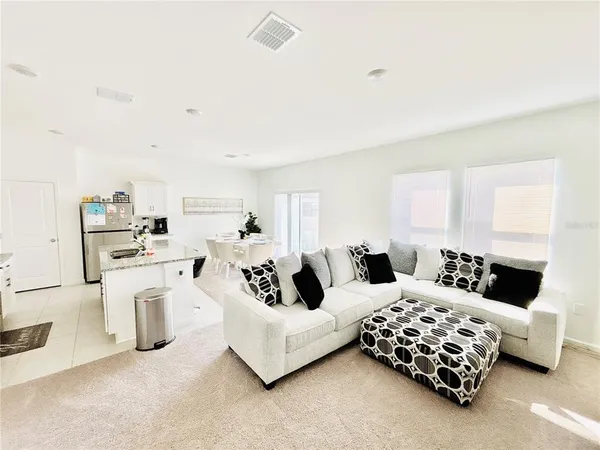 a bedroom with furniture and white walls