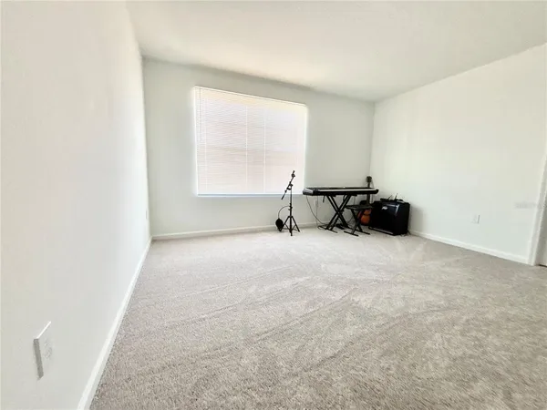 a view of workspace with furniture and window