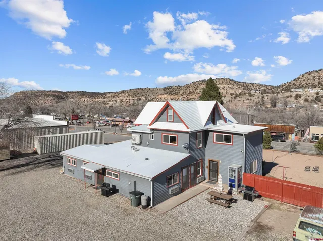 a view of a terrace with a table and chairs