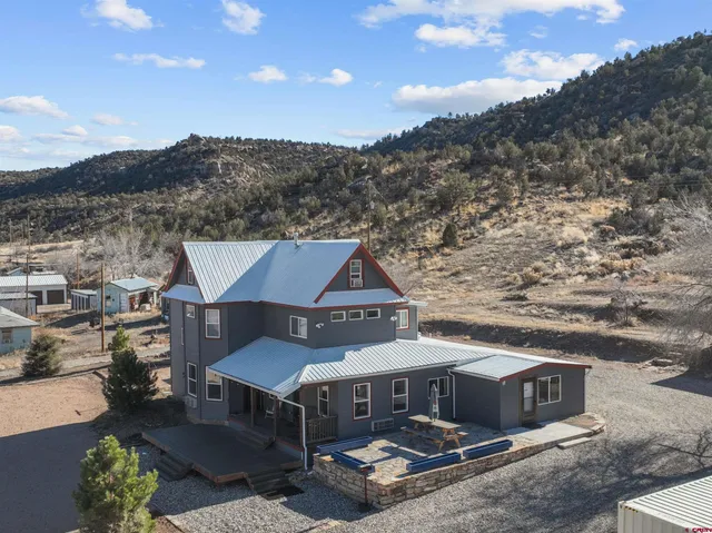 a front view of house with a garden