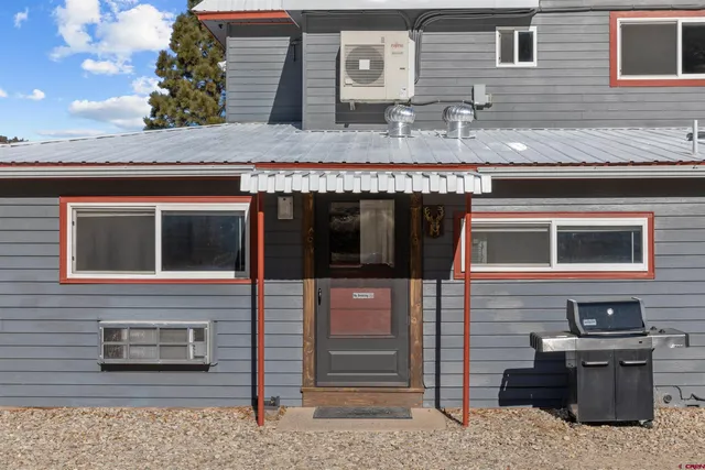 a kitchen with a refrigerator and a stove