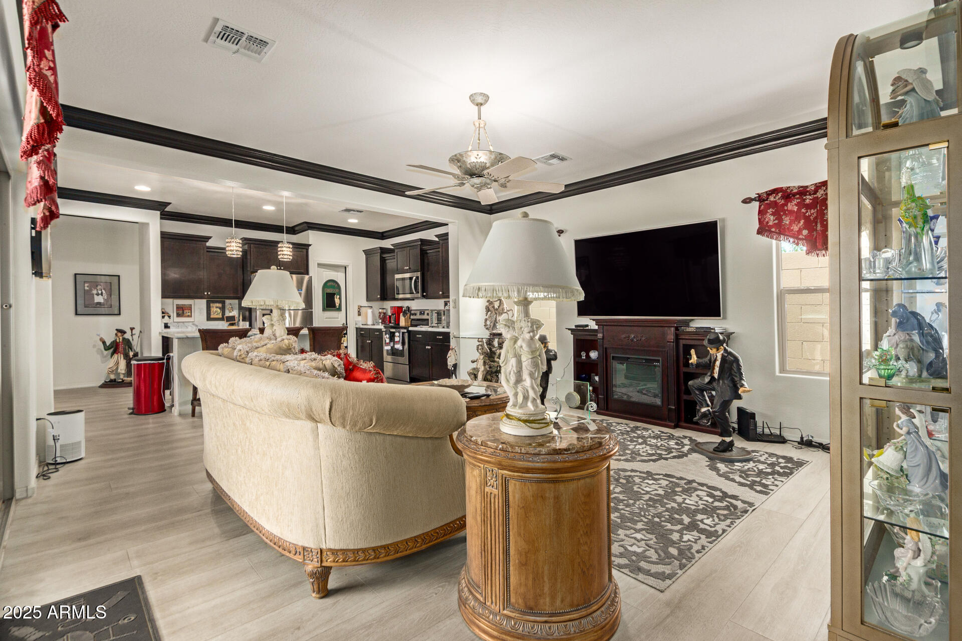 1616 South Aryelle Road Apache Junction, AZ 85119 - Photo 11 of 29 a living room with fireplace furniture and a flat screen tv