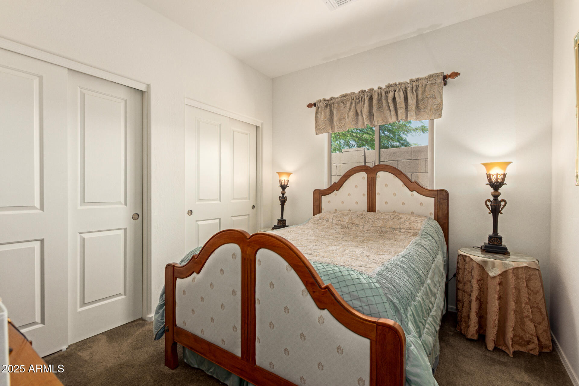 1616 South Aryelle Road Apache Junction, AZ 85119 - Photo 20 of 29 a bedroom with a bed and a window