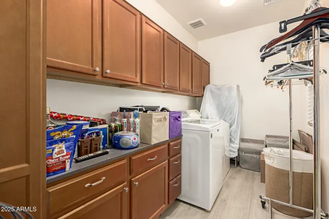 a dinning room with furniture and wooden floor