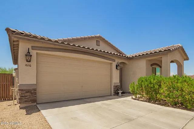 a view of a house with a garage