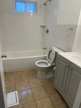 a bathroom with a sink a toilet and a bathtub