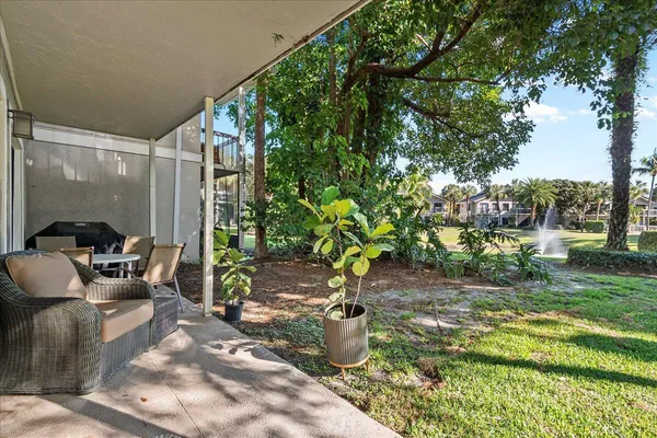 a view of a backyard with sitting area