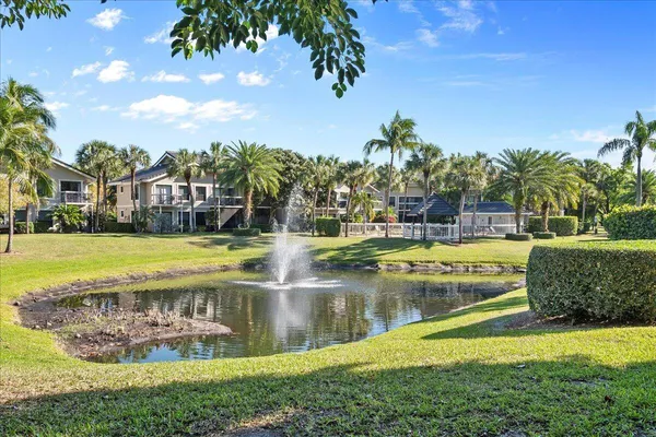 a view of swimming pool with outdoor seating and garden