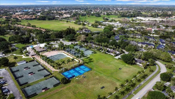 an aerial view of residential houses with outdoor space