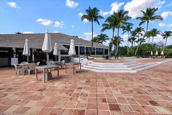 a view of a swimming pool with outdoor seating