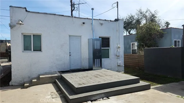 a bedroom with a bed and a television