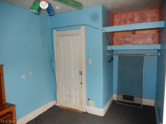 1302 Duncan Street Southwest Massillon, OH 44647 - Photo 13 of 22 Unfurnished bedroom featuring ceiling fan