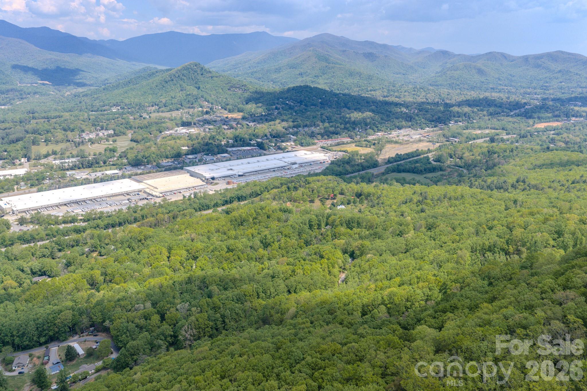 259 Mockingbird Road, Unit 1 Swannanoa, NC 28778 - Photo 6 of 25 a view of a lush green hillside and houses
