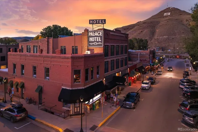 a view of a patio with a table and chairs
