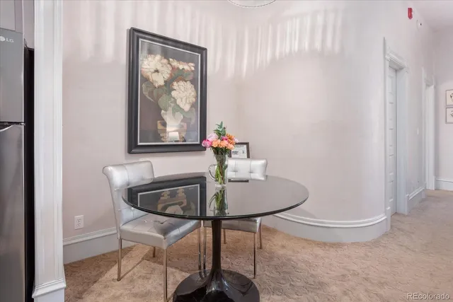 a room with a refrigerator and cabinets