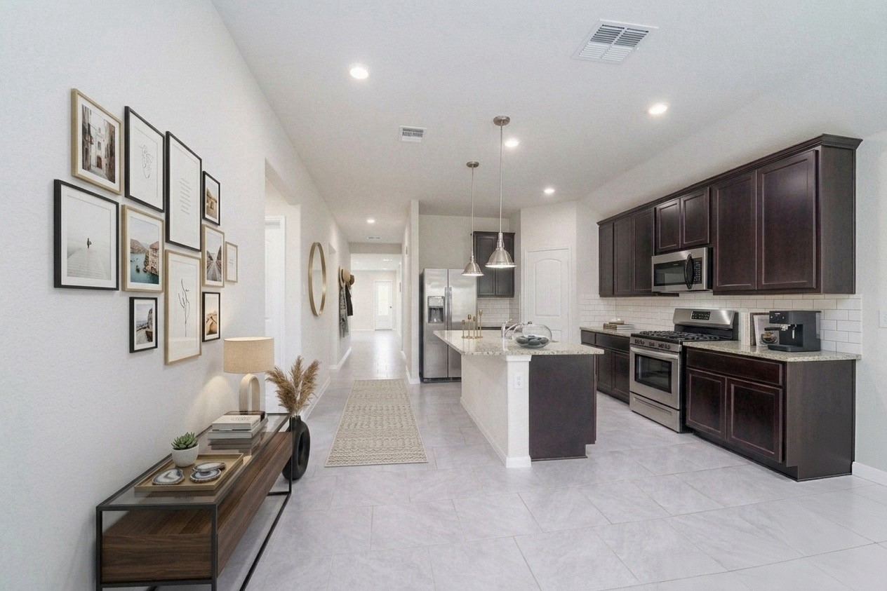 8307 Oakleaf Meadow Court Rosharon, TX 77583 - Photo 9 of 39 a kitchen with a stove and a refrigerator