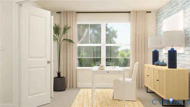 a living room with furniture and large windows