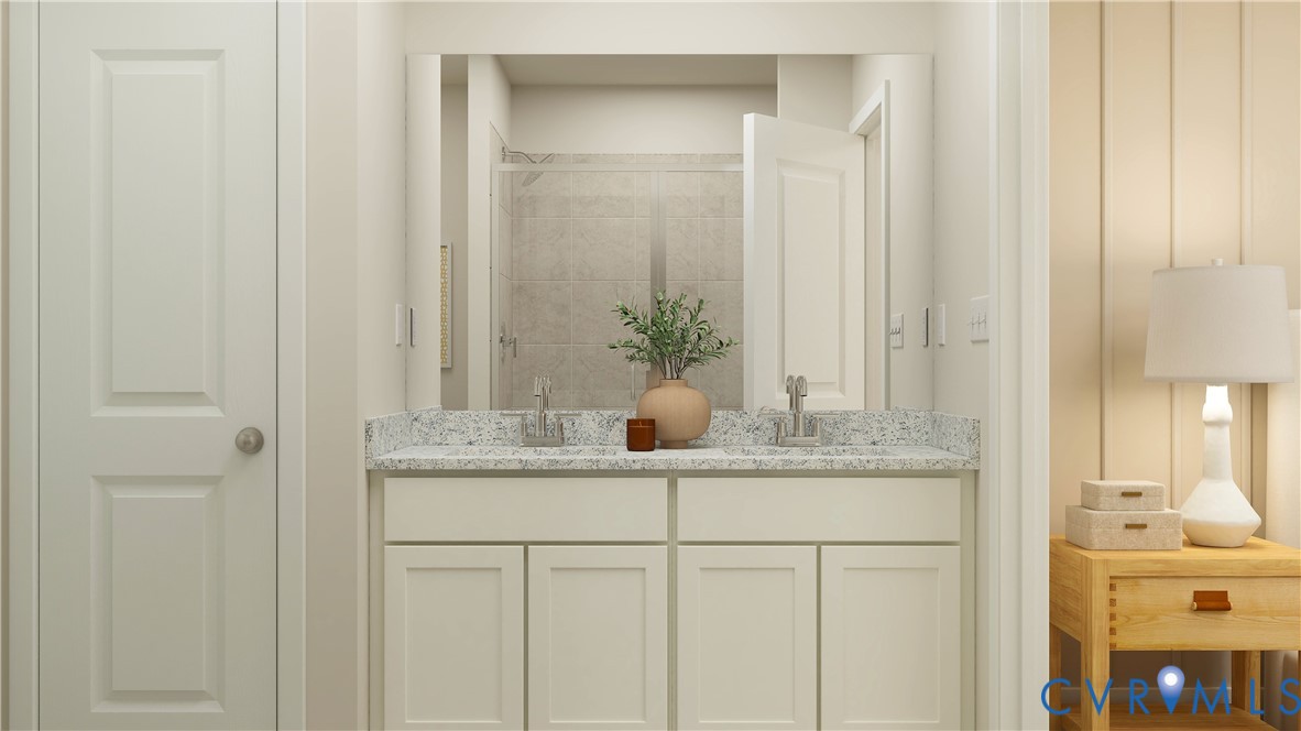 6047 Blue Iris Road Richmond, VA 23225 - Photo 12 of 19 a bathroom with a granite countertop sink and a mirror