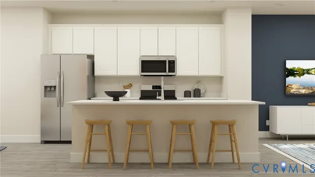 a close view of a kitchen with appliances and cabinets