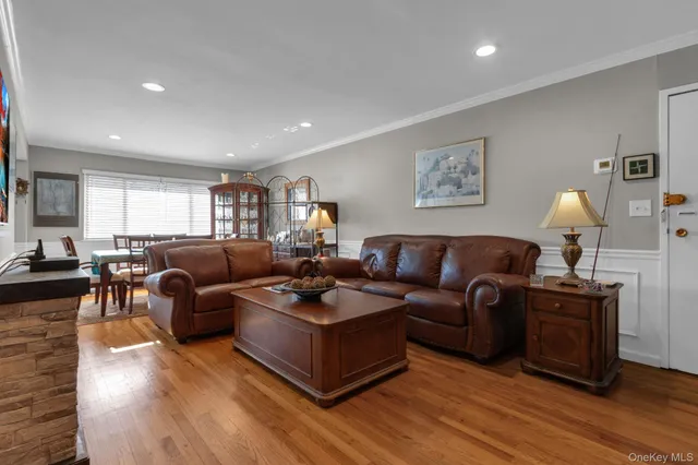 a living room with furniture window and wooden floor