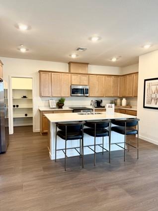 2337 Lingcod Way Rocklin, CA 95765 - Photo 3 of 9 a kitchen with a table chairs a sink dishwasher window and cabinets