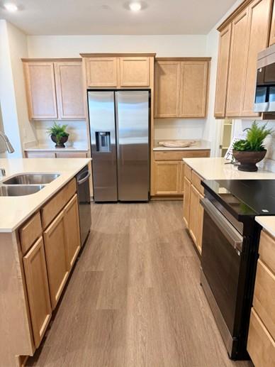 2337 Lingcod Way Rocklin, CA 95765 - Photo 4 of 9 a kitchen with stainless steel appliances granite countertop a refrigerator a sink and a stove