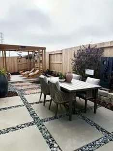 a view of a patio with a table and chairs