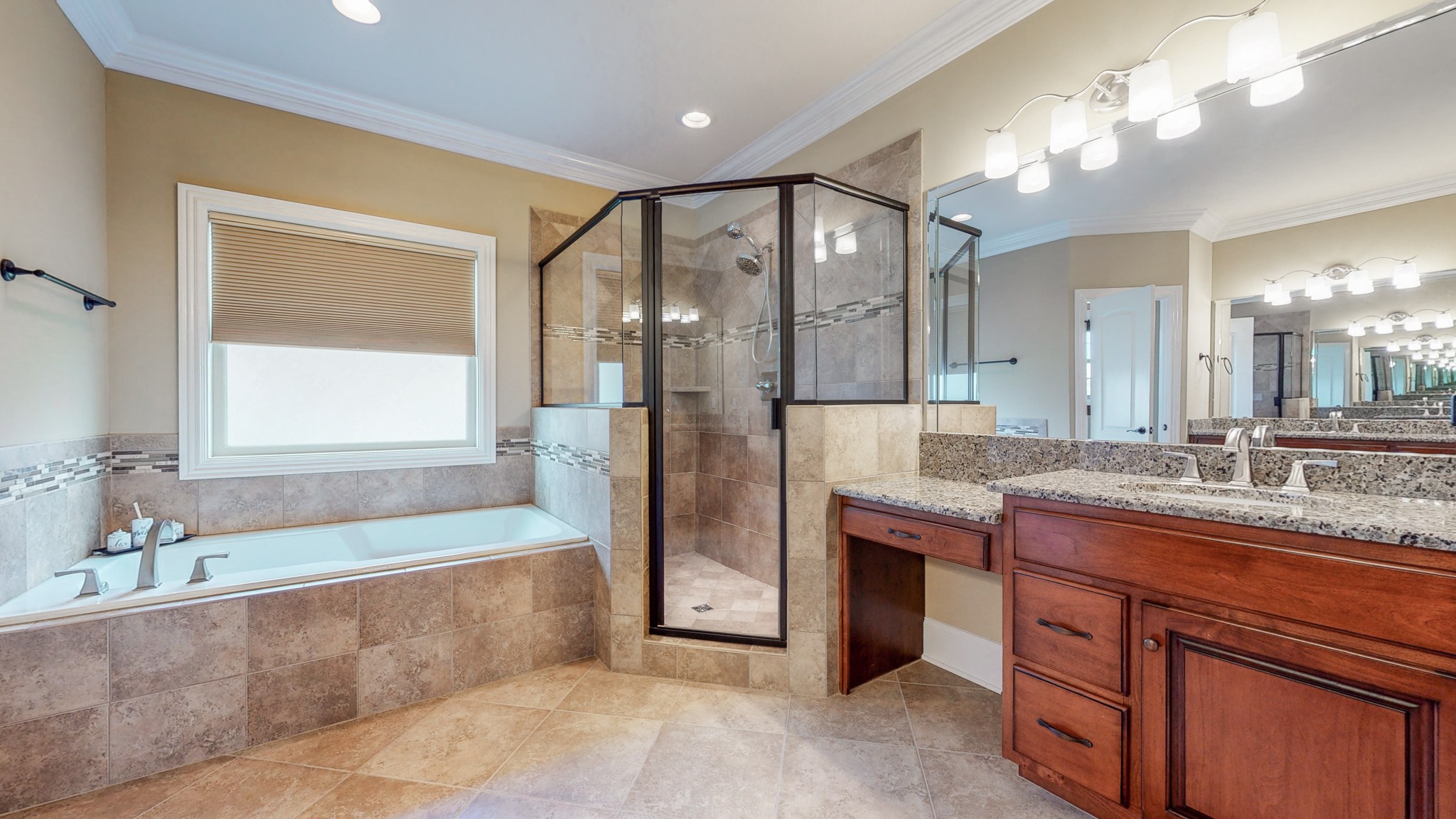 701 Stone Mill Circle Murfreesboro, TN 37130 - Photo 12 of 42 a spacious bathroom with a granite countertop tub sink shower and mirror