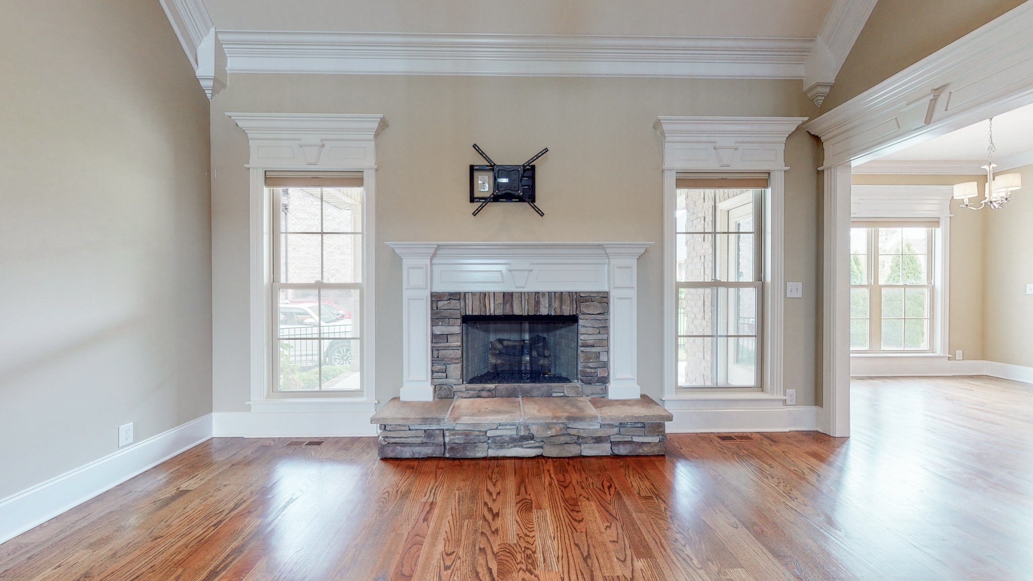 701 Stone Mill Circle Murfreesboro, TN 37130 - Photo 15 of 42 an empty room with wooden floor fireplace and windows