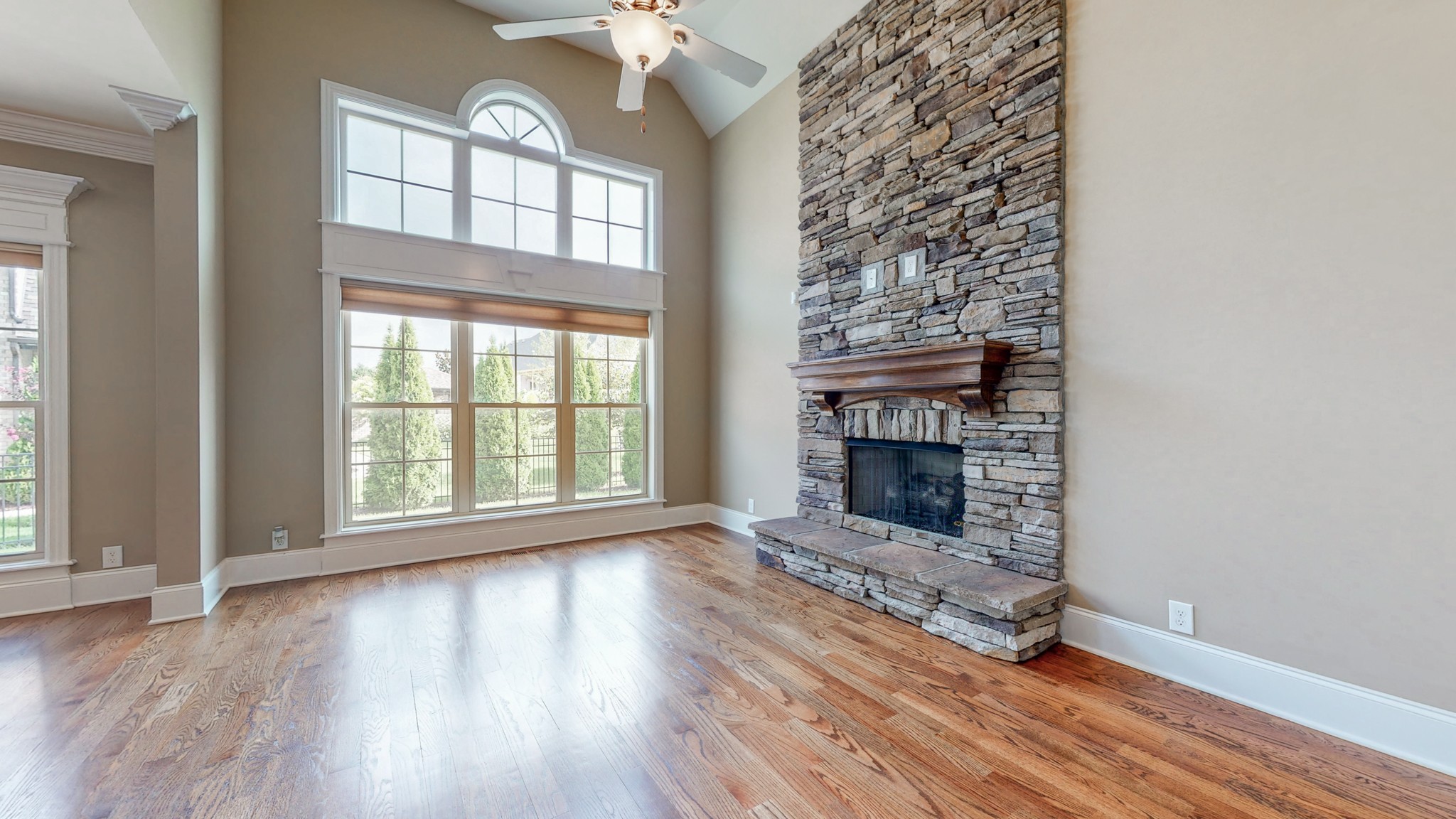 701 Stone Mill Circle Murfreesboro, TN 37130 - Photo 20 of 42 wooden floor fireplace and windows in an empty room