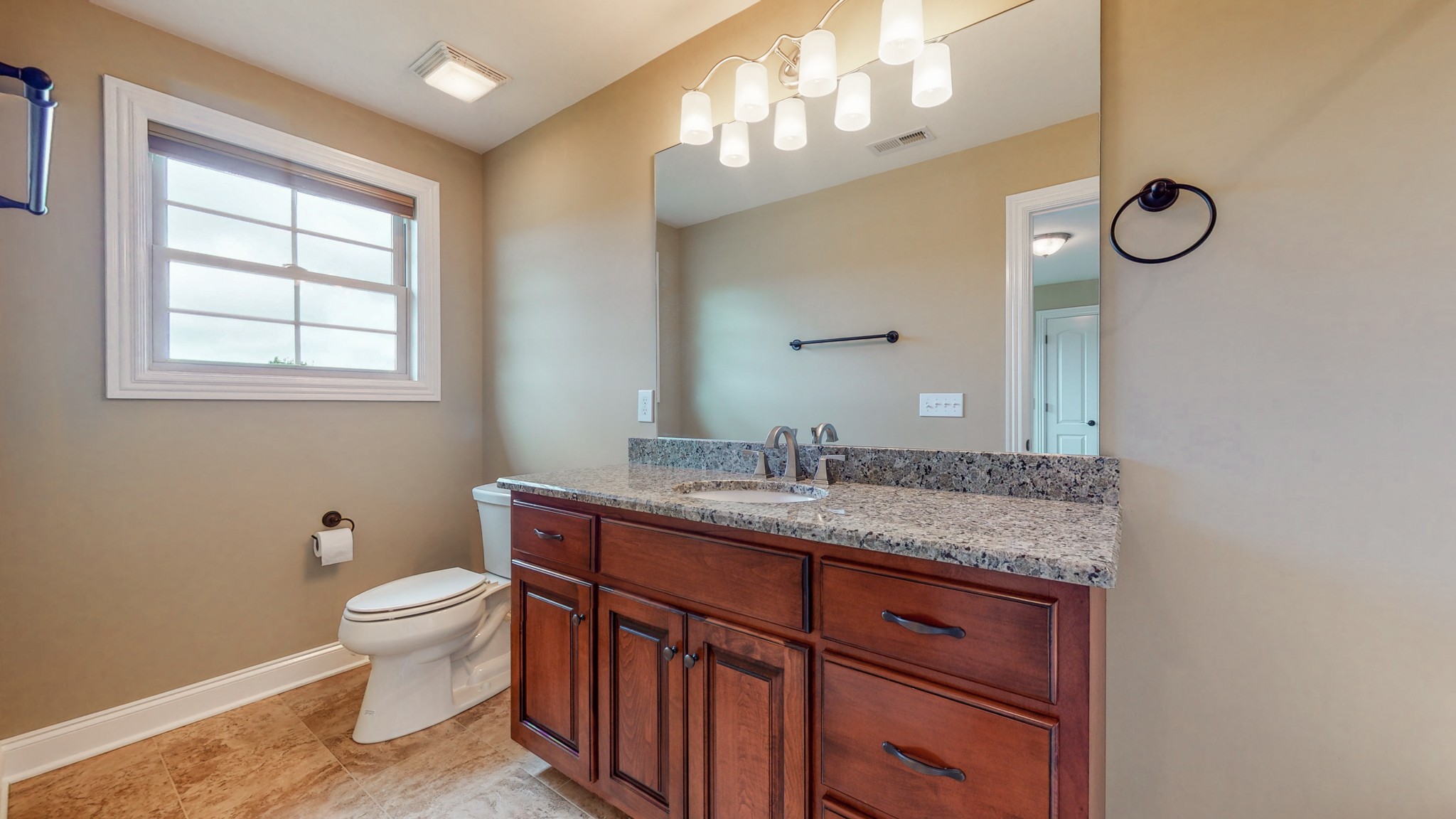 701 Stone Mill Circle Murfreesboro, TN 37130 - Photo 28 of 42 a bathroom with a granite countertop sink a toilet and a mirror
