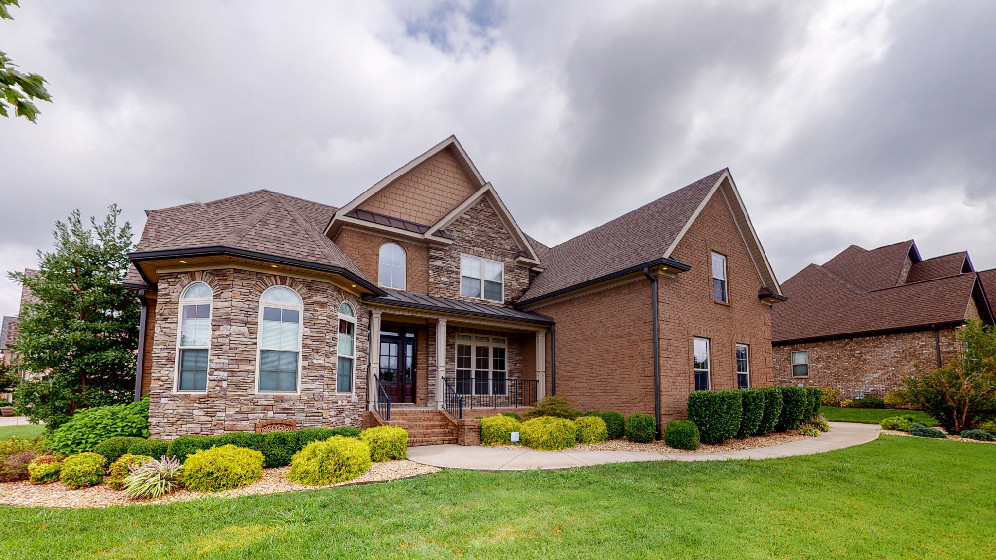701 Stone Mill Circle Murfreesboro, TN 37130 - Photo 35 of 42 a front view of a house with a garden and plants