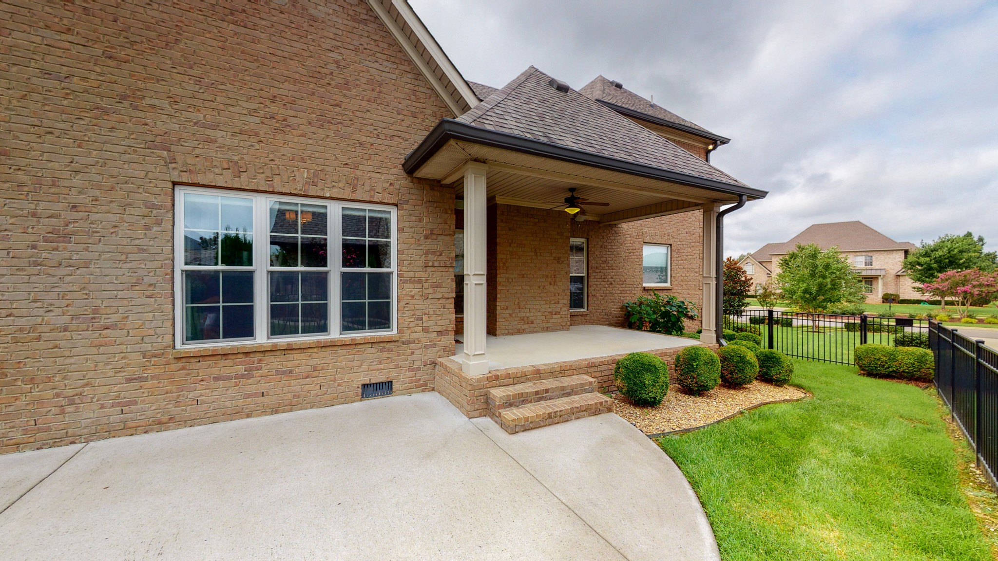 701 Stone Mill Circle Murfreesboro, TN 37130 - Photo 37 of 42 a front view of a house with a yard and potted plants