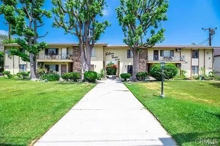 a front view of a house with yard