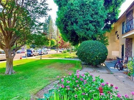 515 Fairview Avenue, Unit 8 Arcadia, CA 91007 - Photo 15 of 15 a green field with flowers and trees