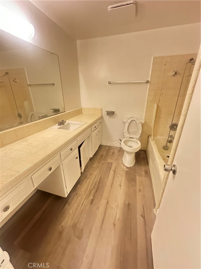 515 Fairview Avenue, Unit 8 Arcadia, CA 91007 - Photo 5 of 15 a bathroom with a sink and a large mirror
