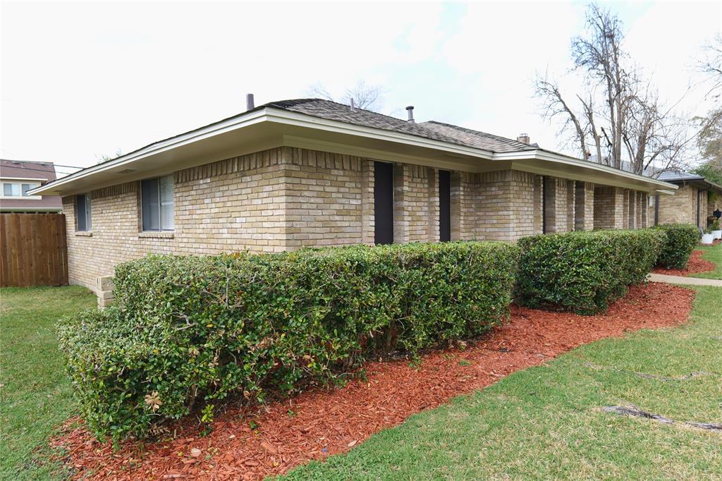 Brick exterior construction featuring multiple windows