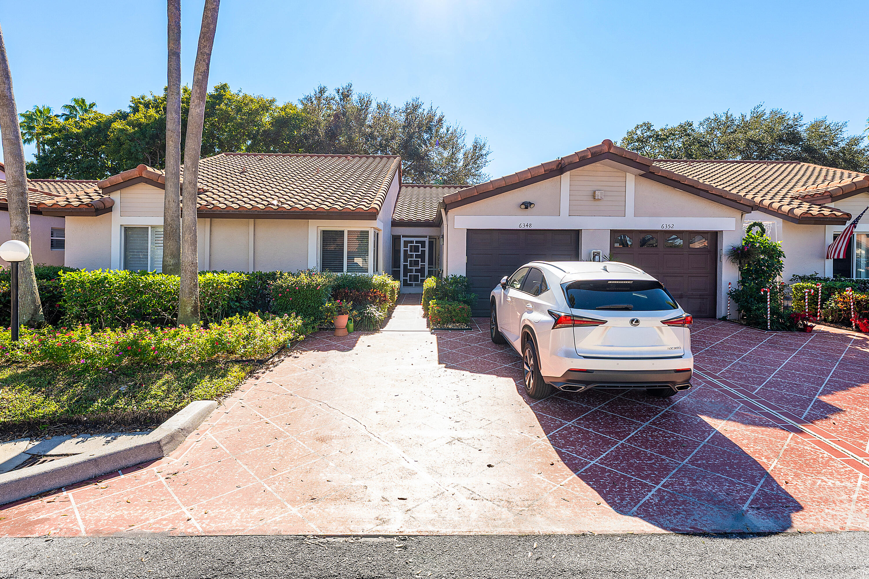 6348 Pointe Pleasant Circle Delray Beach, FL 33484 - Photo 1 of 40 a house view with a outdoor space