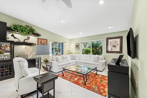 a living room with furniture fireplace and a flat screen tv