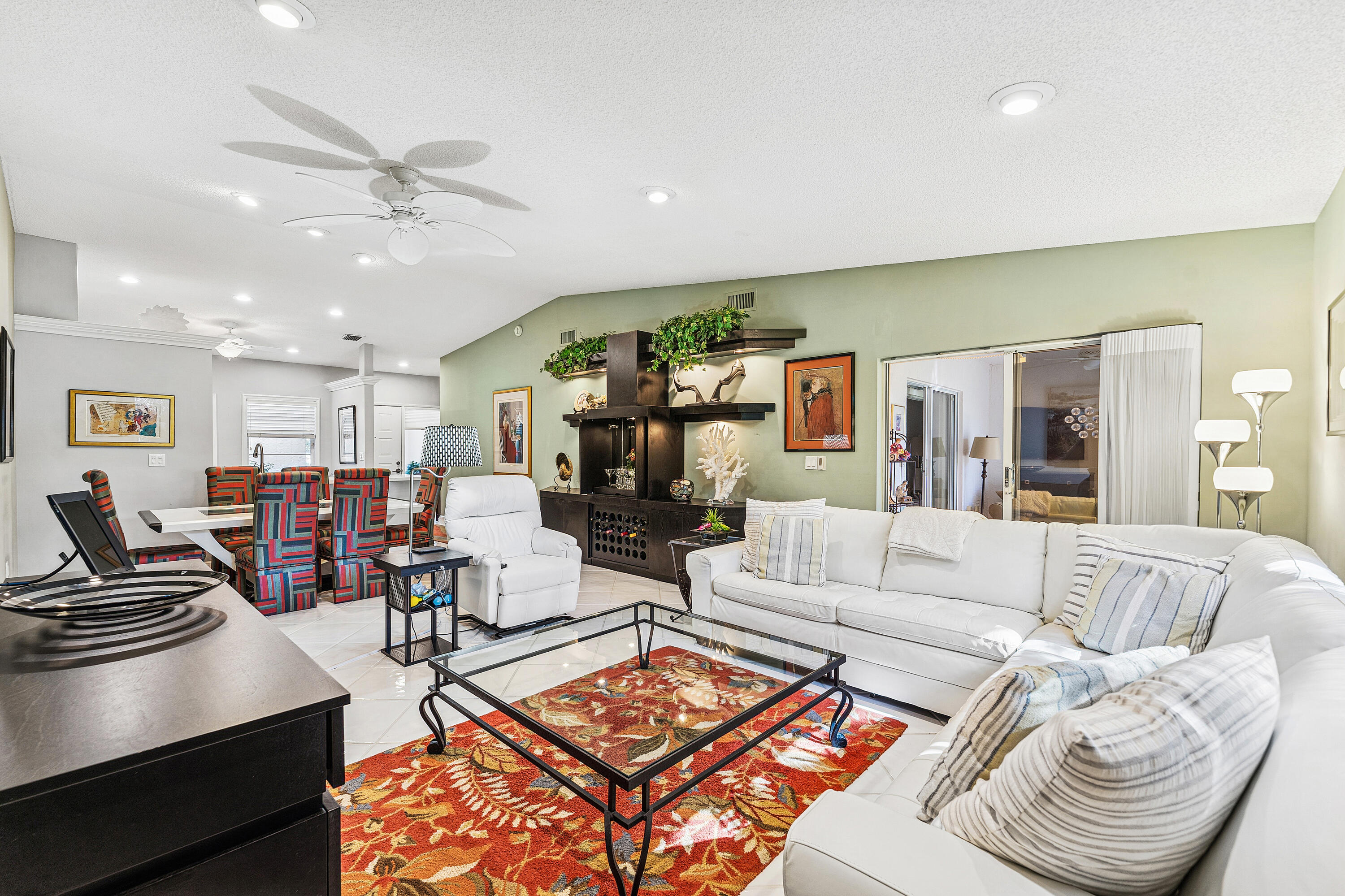 6348 Pointe Pleasant Circle Delray Beach, FL 33484 - Photo 13 of 40 a living room with furniture and kitchen view