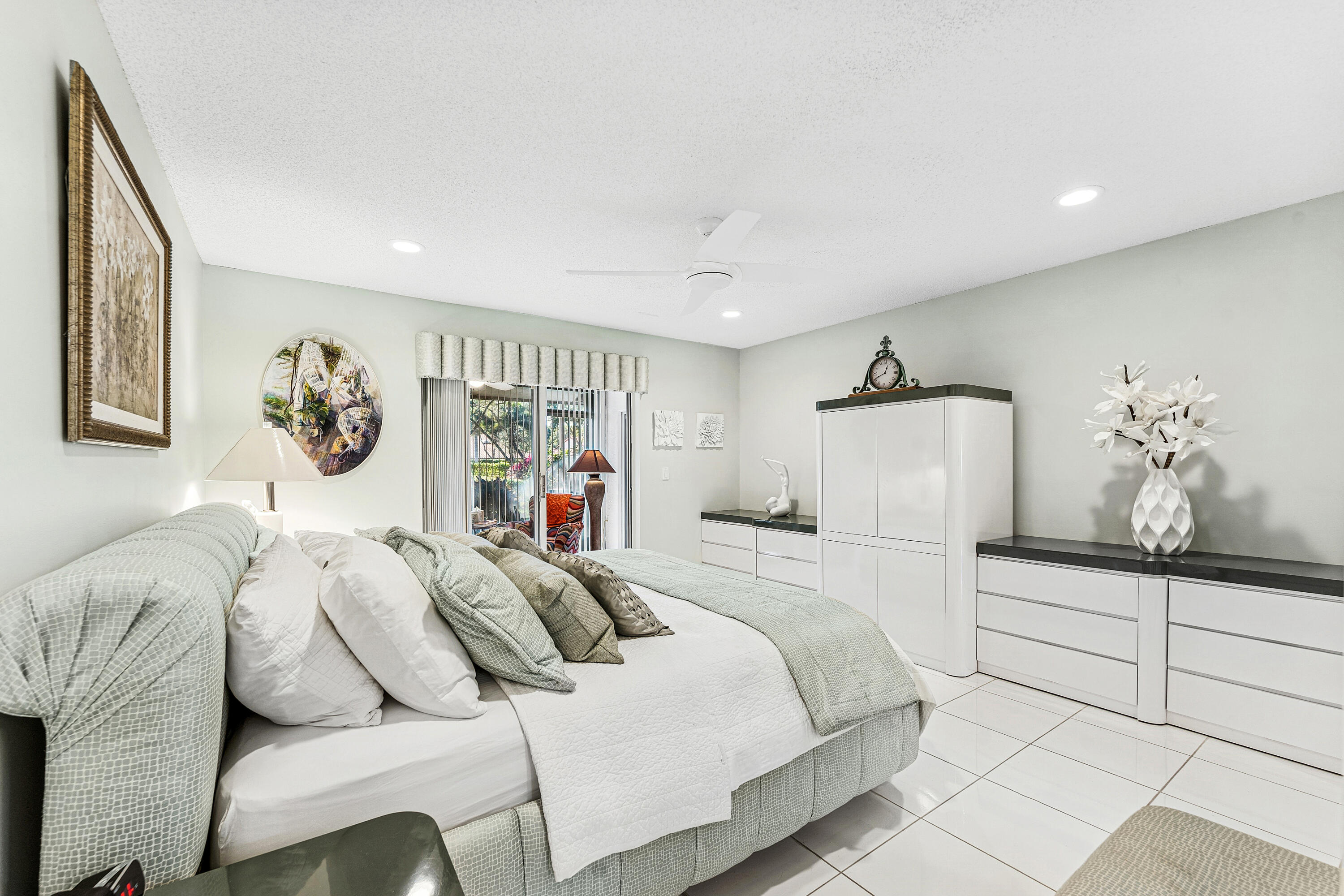 6348 Pointe Pleasant Circle Delray Beach, FL 33484 - Photo 20 of 40 a bedroom with a bed and a window