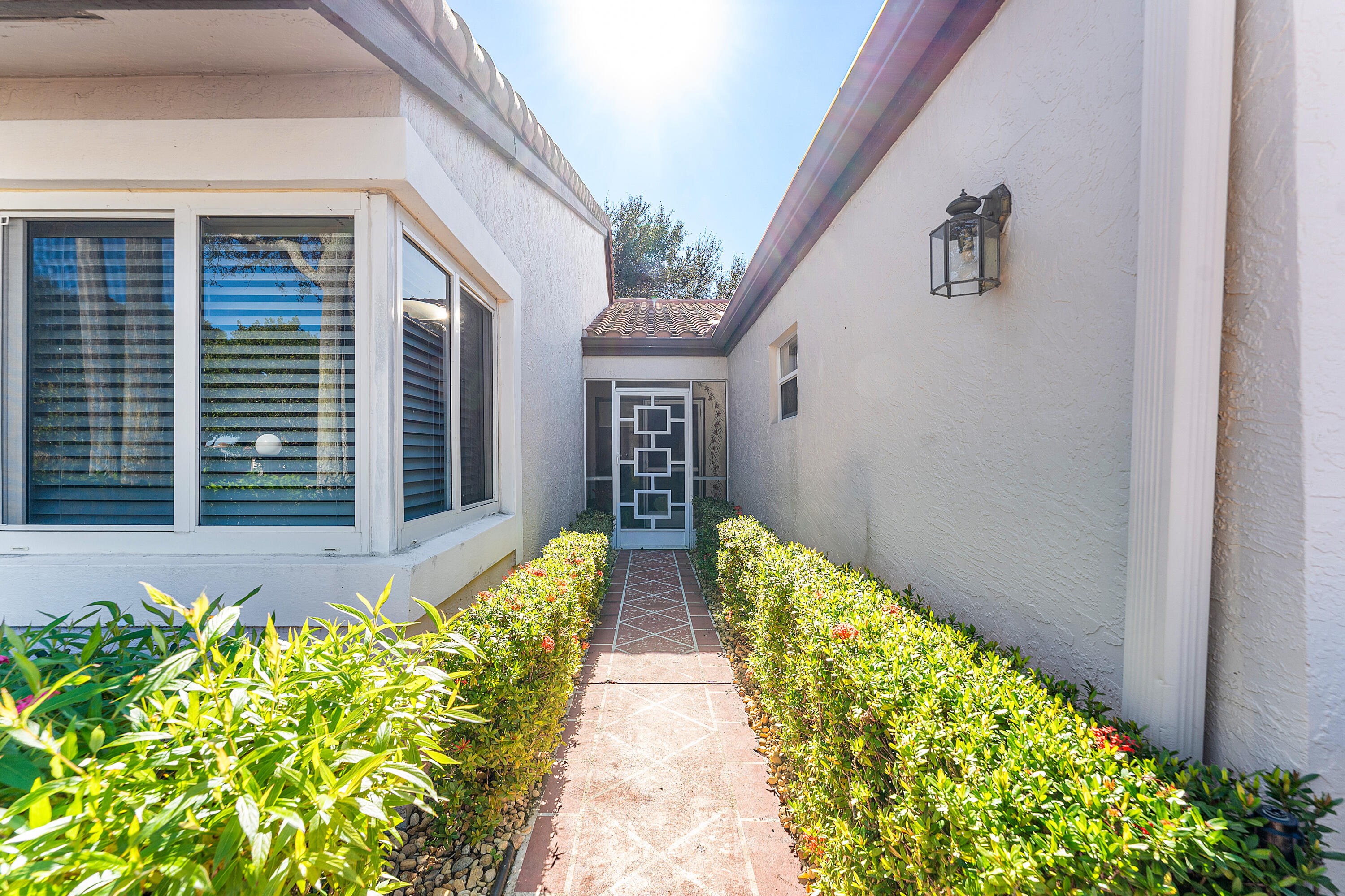 6348 Pointe Pleasant Circle Delray Beach, FL 33484 - Photo 3 of 40 a view of house and front door