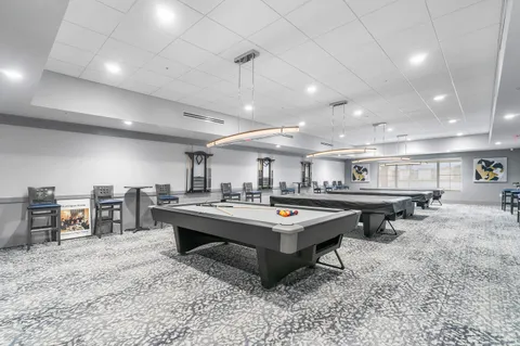 a room with gym equipment and air hockey table